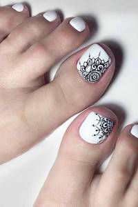 Openwork pattern in black and white pedicure