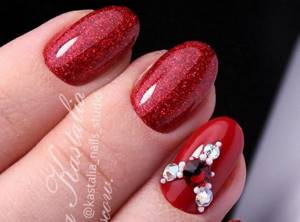 glitter red nails with white rhinestones