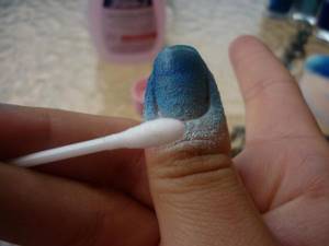 What do you use to smear your finger around your nail when doing a manicure?