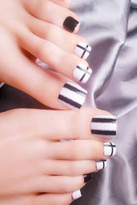 Black and white pedicure with glitter