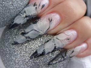 Black and white design on stiletto nails