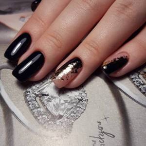 Black-nude manicure with gold foil