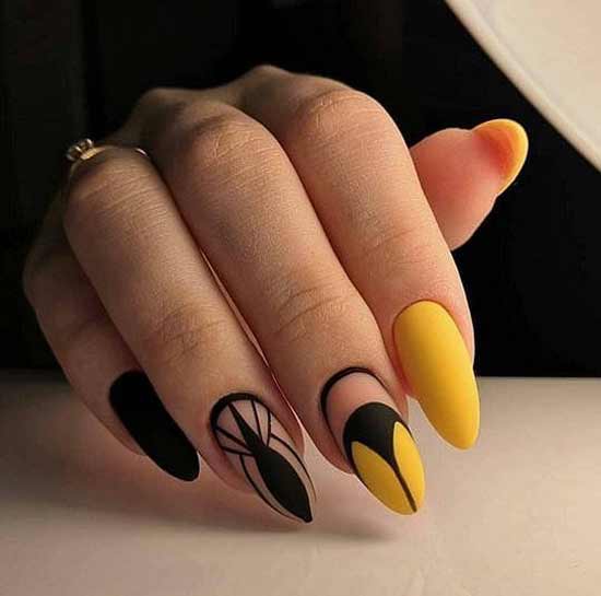 Black and yellow manicure with a triangle