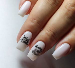 Black lettering on white square nails