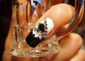 Black liquid stones on stylish nails