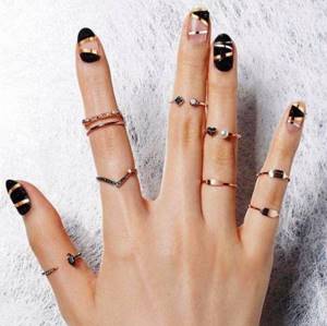 black manicure with gold details