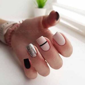Black matte manicure with glitter