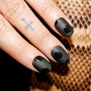 black matte manicure with polka dots