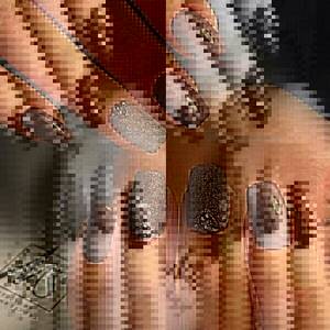 Decor with rhinestones and sparkles in brown manicure