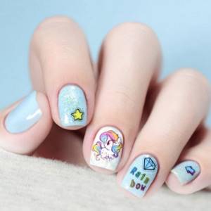Children&#39;s manicure with stickers