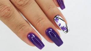 Purple manicure with a flower pattern on long nails