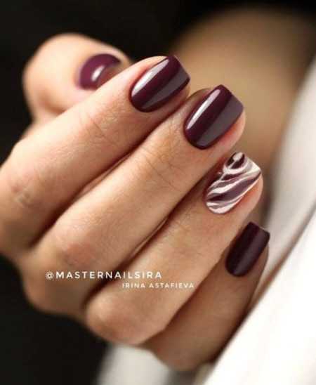Photo of a beautiful burgundy manicure