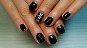 Glossy nail design with black decor