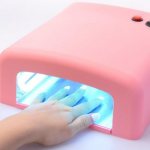 How does an ultraviolet lamp work for drying manicure coatings?