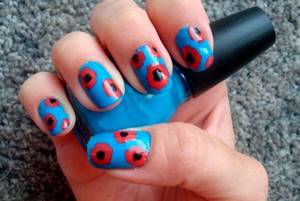 Red and blue manicure with flowers