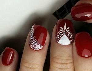red nails with white enzels and rhinestones