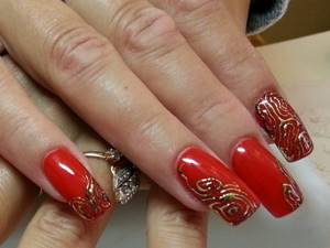 Red liquid stones on beautiful nails, photo