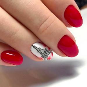red manicure with eiffel tower