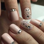 Lunar manicure with nude rhinestones