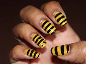 yellow and black manicure