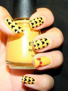 yellow and black manicure