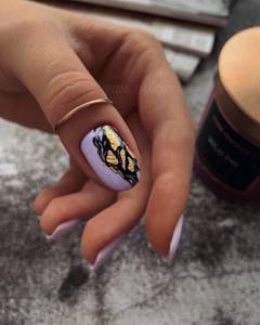 Fashionable manicure with foil 2022-2023: current trends and new items in the photo