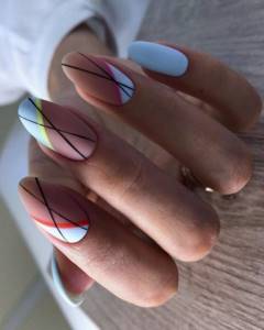 Fashionable manicure in matte colors with geometry on the nails.