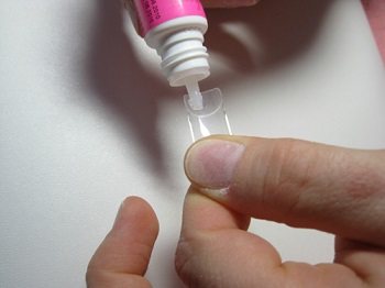 Gluing tips onto the nail