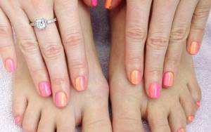Delicate pedicure manicure in pink and peach tones