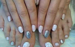 Charmingly delicate floral nail art, combined with French and glitter