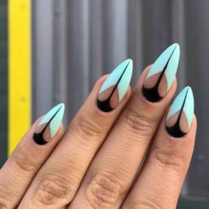 Original manicure in geometry style on all nails in blue and black colors.