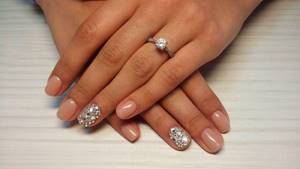 finger lined with rhinestones