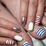 “Beach” manicure pedicure with bright fashionable blue and red stripes