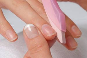 filing nails before applying polish
