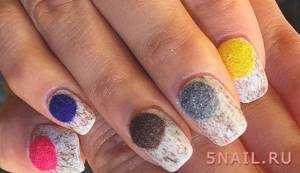 Multi-colored velvet balls on nails look very cute