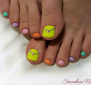 Multi-colored pedicure with rhinestones