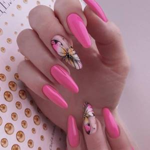 Pink manicure extensions on tips with butterflies