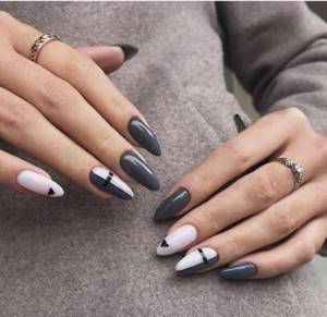 Gray gel polish and white gel polish with a geometry pattern on elongated nails.