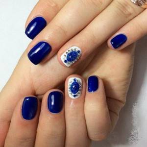 Blue liquid stones on dark blue nails