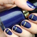 Blue manicure with gold
