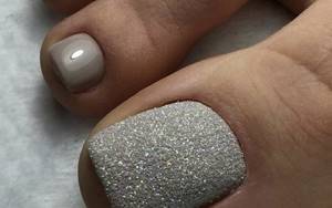 Light gray pedicure with glitter