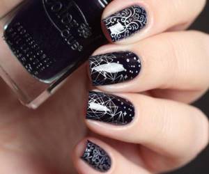 Dark manicure with stamping and stickers