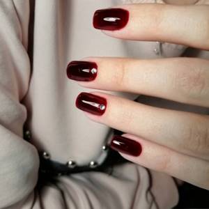 Dark cherry manicure with rhinestones on square nails