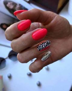 Bright red manicure with sparkles