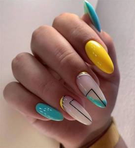 Bright juicy manicure yellow and turquoise gel polish with geometric black lines.