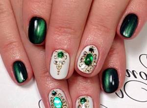 Green liquid stones on beautiful nails