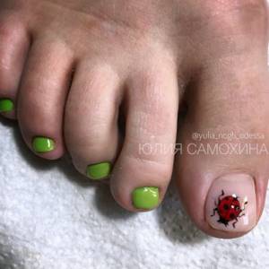 Green and nude pedicure with ladybug