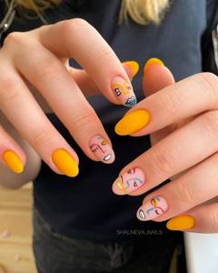 Yellow manicure with a pattern