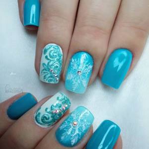 Winter blue manicure with snowflakes